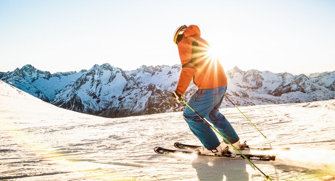 inclinar o corpo ao esquiar